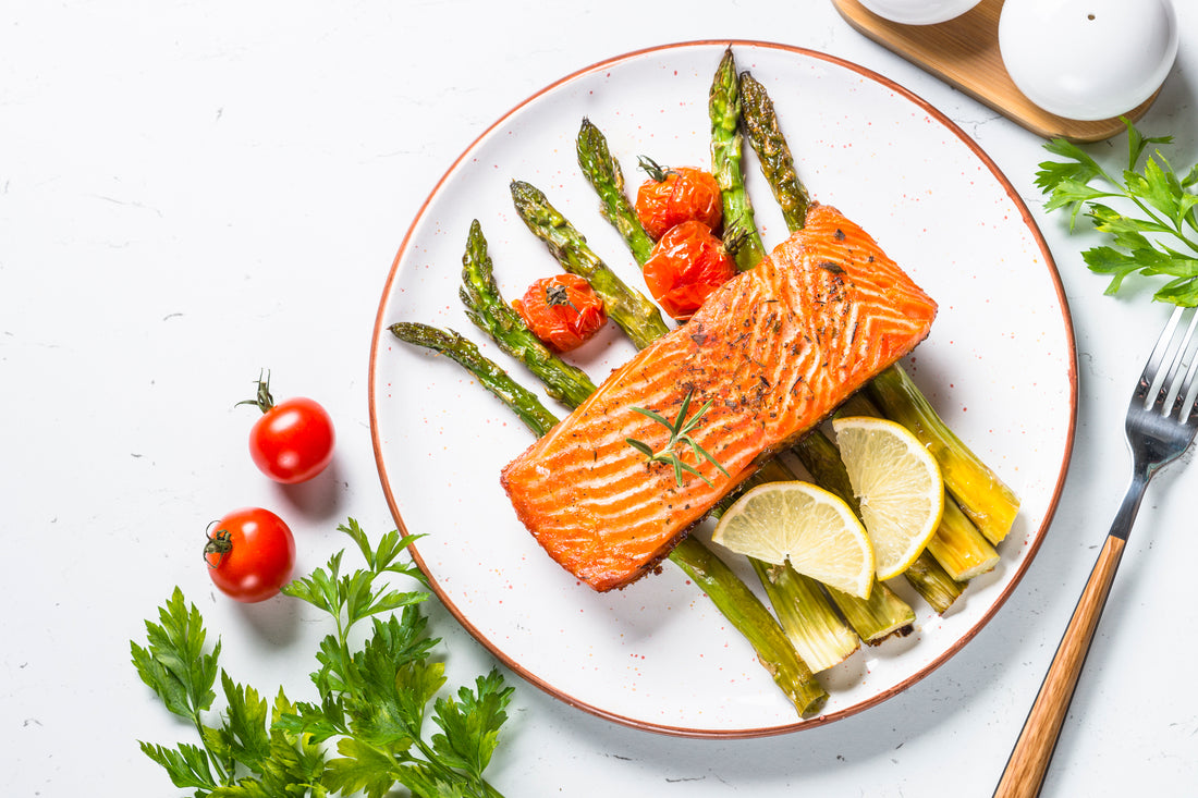 a plate of salmon and vegetables