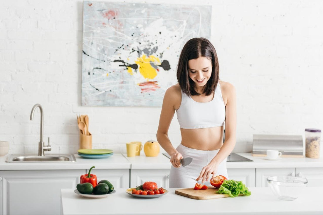 woman cutting vegetables in kitchen keto